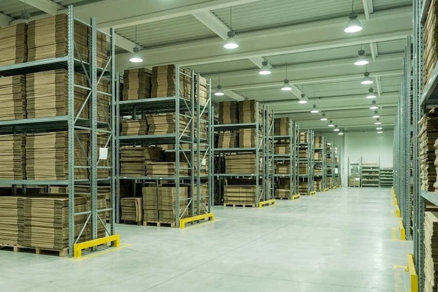 Organized warehouse with packaging materials representing PPWR compliance requirements